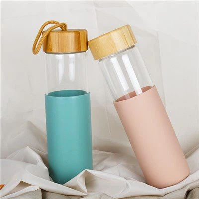 بطری های شیشه ای تک دیواری با درب بامبو و آستین سیلیکونی